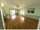 Living room featuring laminate floors and sliding glass doors at 257 Palm Harbor Dr, North Port, FL 34287