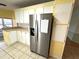 Stainless steel refrigerator in a galley kitchen at 257 Palm Harbor Dr, North Port, FL 34287