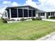 Single-wide mobile home with large screened porch at 257 Palm Harbor Dr, North Port, FL 34287