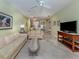Spacious living room with an open floor plan and a view into the kitchen at 688 Back Nine Dr, Venice, FL 34285