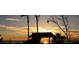 Silhouetted gazebo at sunset over calm ocean at 688 Back Nine Dr, Venice, FL 34285