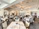 Upscale dining room with numerous tables and chairs, and elegant lighting at 334 Melrose Ct, Venice, FL 34292