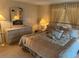Bedroom with queen-size bed and dresser at 923 Cortina Blvd, Venice, FL 34285