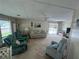 Bright living room with sliding doors leading to outdoor patio at 923 Cortina Blvd, Venice, FL 34285