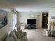 Spacious living room with ample natural light and comfortable furniture at 923 Cortina Blvd, Venice, FL 34285