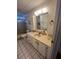 Clean bathroom with vanity, sink, and bathtub at 923 Cortina Blvd, Venice, FL 34285