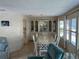 Bright dining room with a large table and built-in hutch at 923 Cortina Blvd, Venice, FL 34285