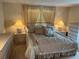 Bedroom with queen-size bed and nightstands at 923 Cortina Blvd, Venice, FL 34285