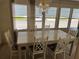 Charming dining area featuring a light wood table and chairs at 923 Cortina Blvd, Venice, FL 34285