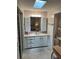 Bathroom with vanity, sink, and shower at 923 Cortina Blvd, Venice, FL 34285