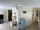 Relaxing living room featuring comfy seating and a ceiling fan at 923 Cortina Blvd, Venice, FL 34285