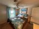 Bright bedroom with a queen bed and beach-themed decor at 923 Cortina Blvd, Venice, FL 34285