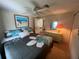 Comfortable bedroom with a queen bed and dresser at 923 Cortina Blvd, Venice, FL 34285