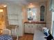 Charming dining area with built-in cabinetry and wood-look floors at 923 Cortina Blvd, Venice, FL 34285