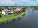 House with a lake view in a residential community at 12002 Granite Woods Loop, Venice, FL 34292