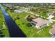A relaxing home features a screened-in pool and a private canal in the backyard at 233 Fairway Rd, Rotonda West, FL 33947