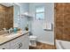 Bathroom with granite vanity, tile floors, modern fixtures, and a shower/tub combo at 233 Fairway Rd, Rotonda West, FL 33947