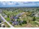 Aerial shot of community with golf course, water features, and a lush landscape to enhance community living at 233 Fairway Rd, Rotonda West, FL 33947