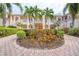 Charming two-story condo with manicured landscaping and a welcoming fountain centerpiece at 4240 Central Sarasota Pkwy # 616, Sarasota, FL 34238