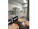 Efficient kitchen features white appliances, abundant cabinet space, and a dining area at 4240 Central Sarasota Pkwy # 616, Sarasota, FL 34238