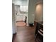 This kitchen has bright white cabinets, black appliances, and dark wood flooring at 4240 Central Sarasota Pkwy # 616, Sarasota, FL 34238