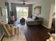 Comfortable living room with natural light, a ceiling fan and sliding doors to the outside at 4240 Central Sarasota Pkwy # 616, Sarasota, FL 34238