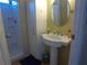 Bathroom with pedestal sink and shower at 6502 Hikina Dr, North Port, FL 34287