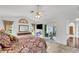 Main bedroom with king bed, patio access, and walk-in closet at 1188 Harbor Town Way, Venice, FL 34292