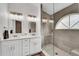 Updated bathroom with double vanity and a large walk-in shower at 1188 Harbor Town Way, Venice, FL 34292