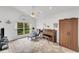 Sunroom with tiled floors, piano, and access to backyard at 1188 Harbor Town Way, Venice, FL 34292