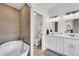 Spa-like bathroom with soaking tub and double vanity at 1188 Harbor Town Way, Venice, FL 34292