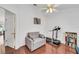 Bright home office with a sleeper sofa and hardwood floors at 1188 Harbor Town Way, Venice, FL 34292
