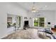 Sunroom with tiled floors, access to backyard, and relaxing seating at 1188 Harbor Town Way, Venice, FL 34292