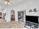 Gathering room with tiled floors, access to kitchen and sunroom at 1188 Harbor Town Way, Venice, FL 34292