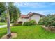Front view of house with landscaping and driveway at 1188 Harbor Town Way, Venice, FL 34292
