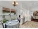 Eat-in kitchen with white cabinetry, tile flooring, and a breakfast nook at 1188 Harbor Town Way, Venice, FL 34292