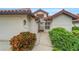 Inviting exterior with walkway, landscaping, and a two-car garage at 1188 Harbor Town Way, Venice, FL 34292