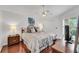 Spacious bedroom with king-size bed and hardwood floors at 1188 Harbor Town Way, Venice, FL 34292