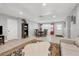 Open concept living and dining area with tile flooring, a neutral color palette, and ample natural light at 8509 La Boca Ave, North Port, FL 34287
