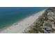 Aerial view of beach with boardwalk and basketball court at 8509 La Boca Ave, North Port, FL 34287