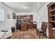 Home office with built-in bookcases and a large desk at 8509 La Boca Ave, North Port, FL 34287