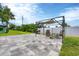 Large backyard patio with pergola, grill, and seating area at 8509 La Boca Ave, North Port, FL 34287