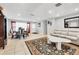 Open concept living and dining area with tile flooring, a neutral color palette, and ample natural light at 8509 La Boca Ave, North Port, FL 34287
