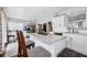 Modern kitchen with white cabinets, marble countertops, and stainless steel appliances at 8509 La Boca Ave, North Port, FL 34287