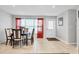 Bright dining room featuring a wood table with six chairs and access to exterior at 8509 La Boca Ave, North Port, FL 34287