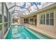 Relaxing pool and patio area with covered seating at 4376 Corso Venetia Blvd, Venice, FL 34293