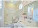 Clean bathroom with a shower/tub combo and updated vanity at 4376 Corso Venetia Blvd, Venice, FL 34293