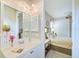 Small bathroom with single vanity and shower/tub combo at 4376 Corso Venetia Blvd, Venice, FL 34293