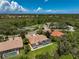 Community overview featuring tennis courts and homes with pools at 4376 Corso Venetia Blvd, Venice, FL 34293