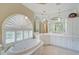 Bright bathroom with a soaking tub and updated fixtures at 4376 Corso Venetia Blvd, Venice, FL 34293